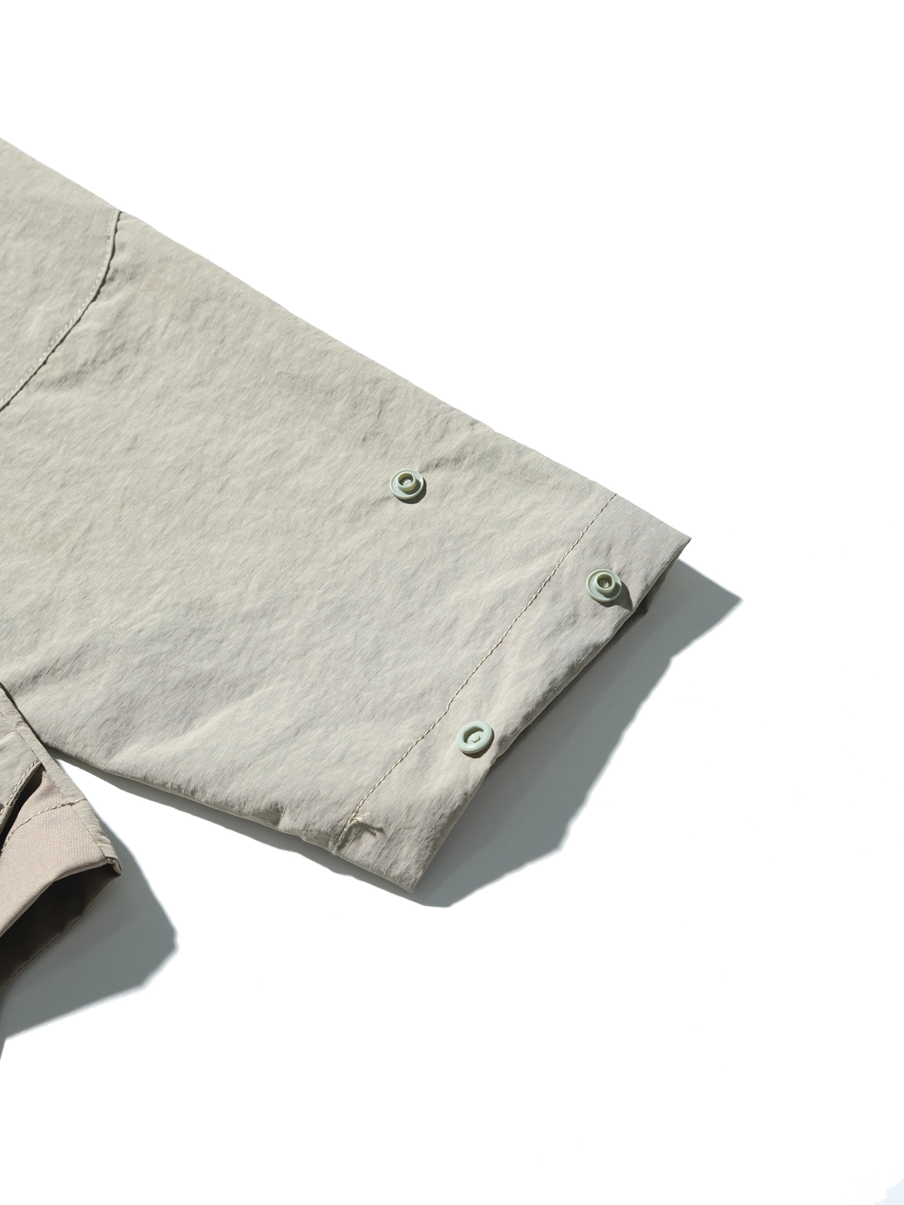 AW23 / 01 — T23-073  Trapezoidal Stereo Visor Shirt (Sand)