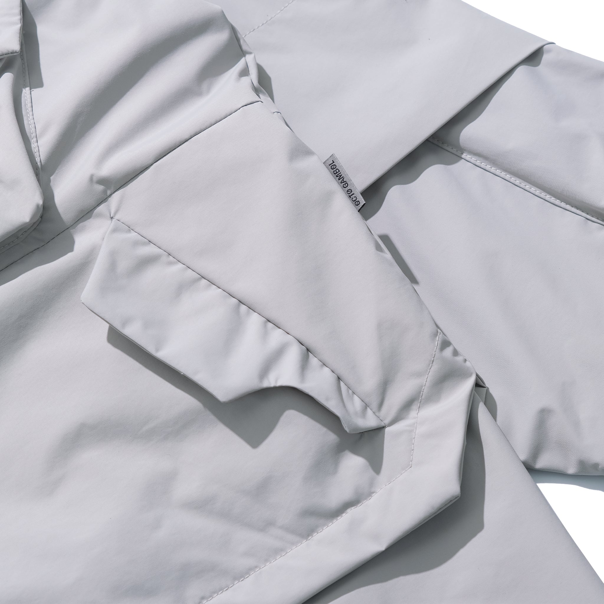 AW22 / 03 — J22-022 Expandable Crossbag Windbreaker (Ivory Grey)